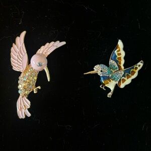 Two hummingbird brooches